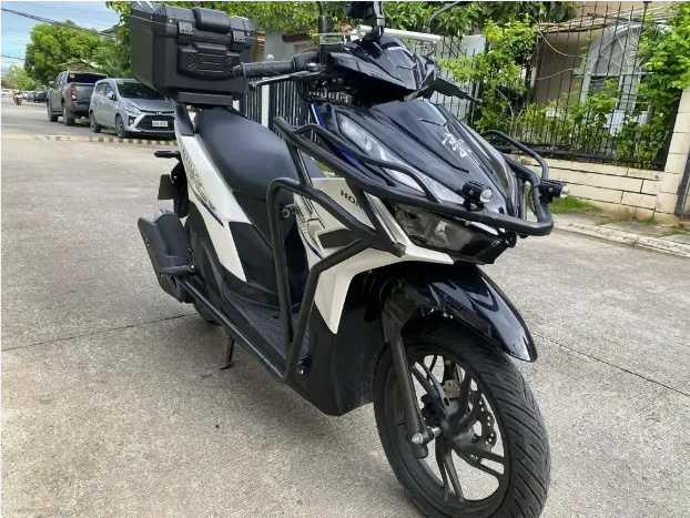 Rider on a scooter, Cebu coastline